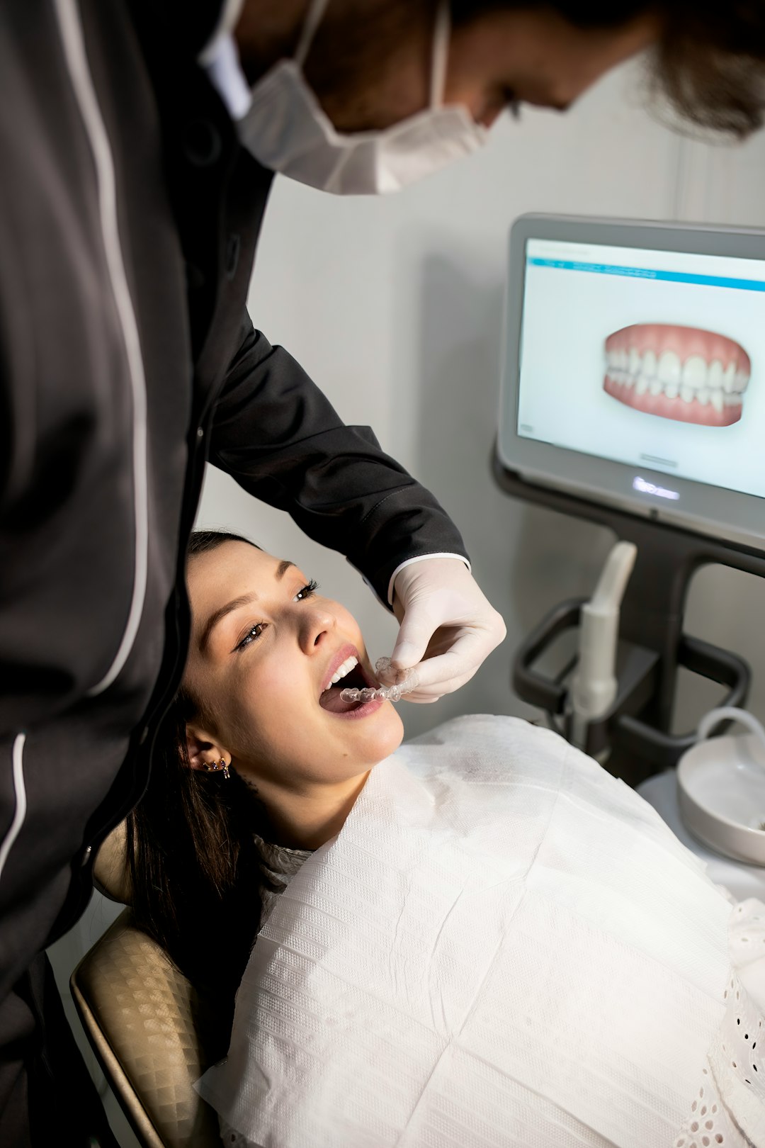 Dentist checking a patient's teeth during a routine appointment
